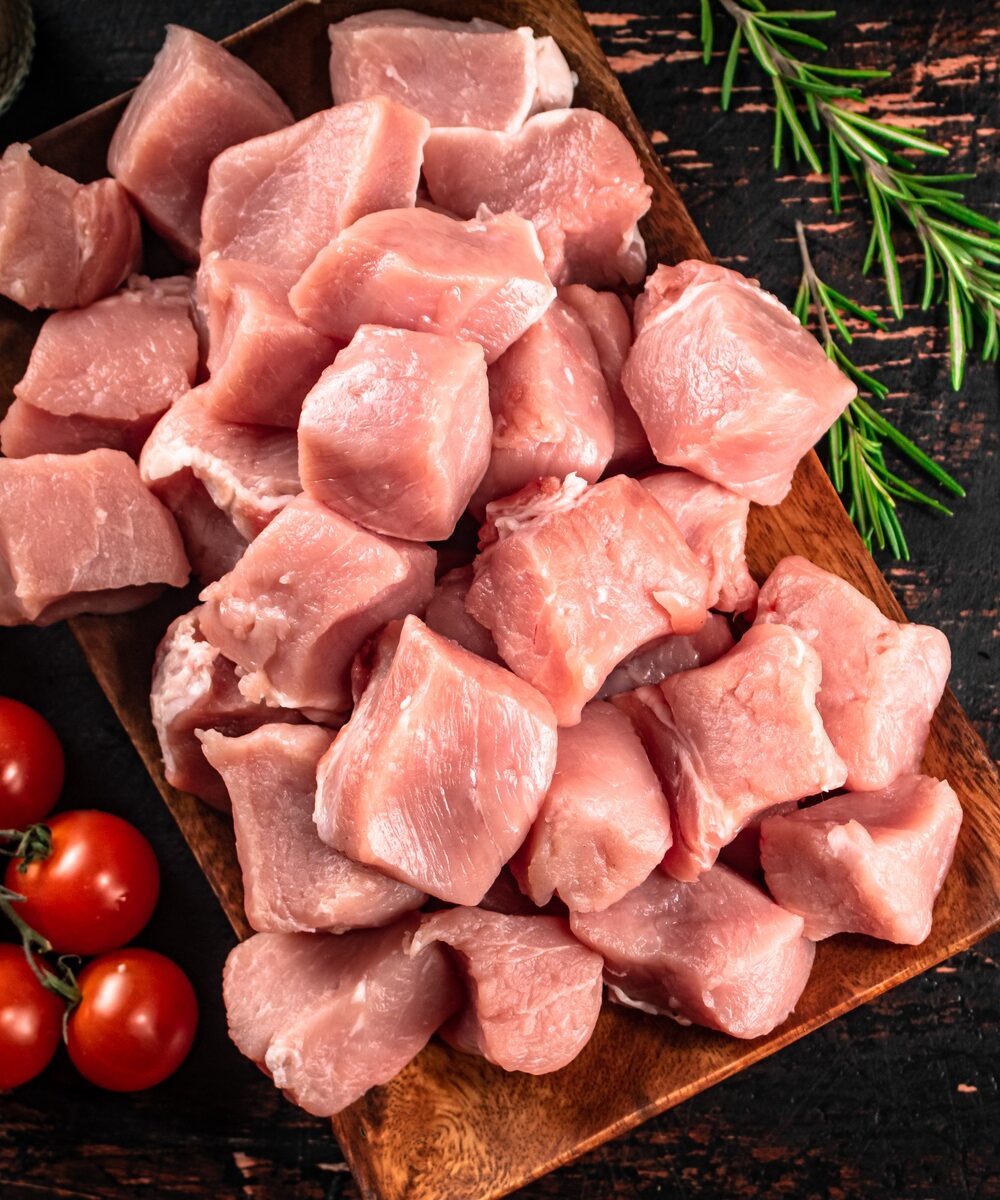 Chopped raw pork with a sprig of cherry tomatoes.