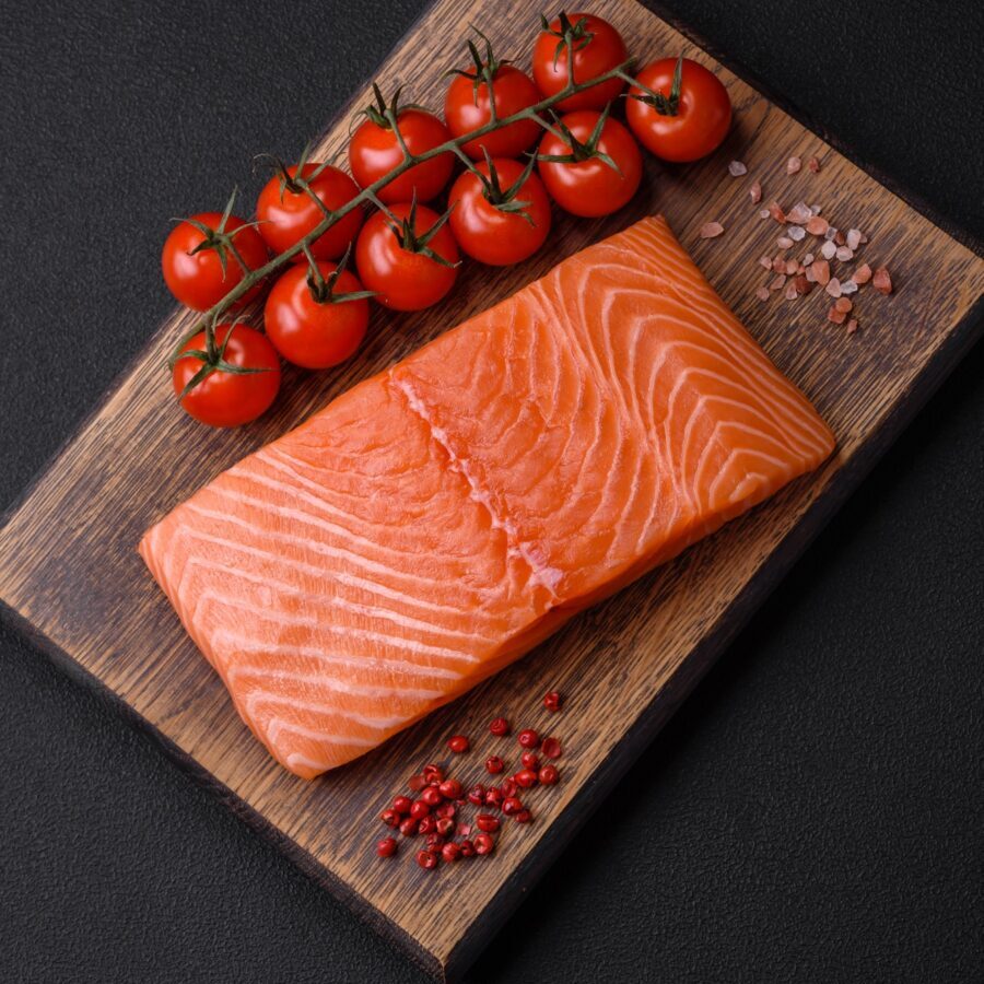 Fresh raw salmon red fish fillet with salt and spices